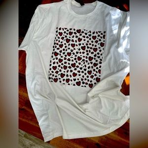 Women’s t shirt red hearts outlined in black.  Very cute!